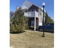 Charming two-story home with brick accents, white trim, a private balcony, and well-maintained landscaping at 12145 Bubbling Brook Dr # 600, Fishers, IN 46038