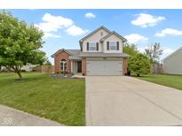 Charming two-story home with a well-manicured lawn and inviting curb appeal at 12612 Clearview Ln, Indianapolis, IN 46236
