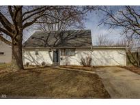 Charming one-story home with a quaint front yard and a driveway leading to an attached garage at 2178 Alton St, Beech Grove, IN 46107