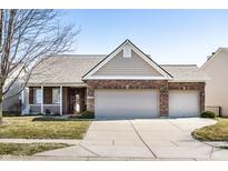 Charming single-Gathering home boasts a brick facade, two-car garage, and well-maintained lawn at 3439 Firethorn Dr, Whitestown, IN 46075