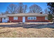 Charming brick ranch home with a well-maintained yard and welcoming front entrance at 493 N Avon Ave, Avon, IN 46123