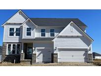 New construction home with a two-car garage, stone accents, and a charming craftsman-style design at 6272 Willow Branch Way, Plainfield, IN 46168