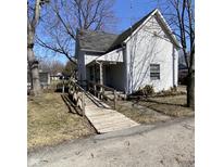 Quaint two-story home with a ramp leading to the front door at 710 E 6Th St, Anderson, IN 46012