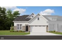 Charming single-Gathering home with brick and white siding, complemented by a two-car garage and well-manicured lawn at 7572 Bluegill Dr, Noblesville, IN 46062