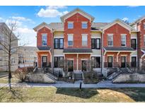 Charming townhomes feature brick facade, black accents, and inviting entryways at 1074 Reserve Way, Indianapolis, IN 46220