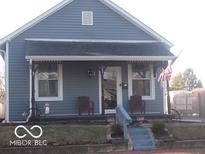 Charming blue bungalow with a cozy front porch and decorative accents at 1507 Hannibal St, Noblesville, IN 46060
