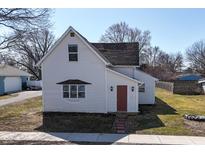 Charming two-story home with white siding and a red front door at 207 E Wall St, Advance, IN 46102