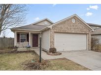 Charming single Gathering home featuring a two-car garage and a cozy front porch at 294 Bent Stream Ln, Brownsburg, IN 46112
