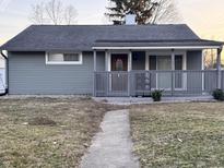 Charming single-story home with a covered front porch and well-maintained lawn at 3561 Bowen Pl, Indianapolis, IN 46221