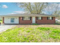 Ranch style home featuring a mix of brick and siding with a grassy front yard at 4113 Gambel Rd, Indianapolis, IN 46221