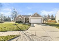 Charming home featuring a two-car garage, well-maintained lawn, and attractive landscaping at 481 Autumn Springs Ct, Avon, IN 46123