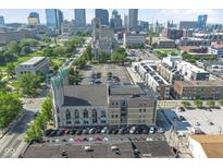 An aerial view shows the property in a vibrant downtown location, near other apartments and businesses at 802 N Meridian St # 204, Indianapolis, IN 46204