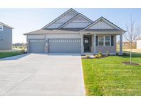 Charming single-Gathering home featuring a two-car garage and well-maintained front lawn at 2268 Oakmont Dr, Plainfield, IN 46168