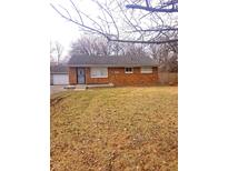 Charming brick home featuring a well-maintained lawn and an inviting entrance at 3550 N Edmondson Ave, Indianapolis, IN 46226