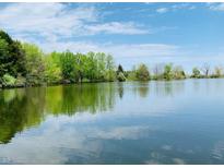 Scenic lake view with lush trees along the shoreline under a partly cloudy blue sky at 1361 S 700 W, Morgantown, IN 46160