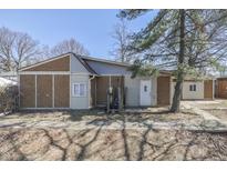 Modest single story home with unique exterior and covered front entry, set on a sunny lot at 3655 Yellow Poplar Ct, Indianapolis, IN 46222