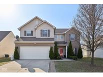Charming two-story home with a two-car garage and well-manicured landscaping at 3832 Kilburn Ct, Indianapolis, IN 46228