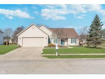 Charming single-story home with a well-manicured lawn, attached garage, and inviting curb appeal at 9930 Chinquapin Ct, Carmel, IN 46033
