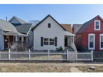 Charming home featuring white picket fence, inviting curb appeal, and a classic design at 1129 Church St, Indianapolis, IN 46225