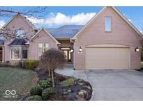 Charming brick home with well-manicured landscaping and a two-car garage at 1621 Rosebud Ln, Greenwood, IN 46143