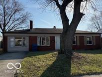 Charming single-story home with mature tree in front yard at 2335 Courtney Rd, Indianapolis, IN 46219