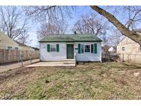 Charming single-story home with a green roof, shutters, and a small front yard at 2354 N Moreland Ave, Indianapolis, IN 46222