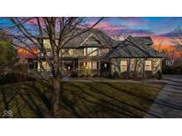 Stunning two-story home featuring a beautiful wrap-around porch and lush lawn at 3608 Olive Branch Rd, Greenwood, IN 46143