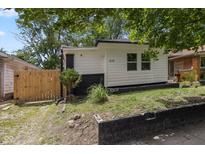 View of the side and front of the home, showing the freshly painted exterior at 516 N Chester Ave, Indianapolis, IN 46201