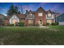 Charming two-story home with brick and siding, manicured landscaping, and a well-maintained lawn at 12715 Charing Cross Rd, Carmel, IN 46033