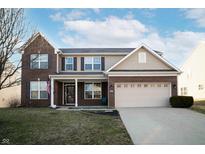 Inviting two-story home featuring a brick and siding facade, attached two-car garage, and well-manicured lawn at 1618 Lavender Ln, Greenwood, IN 46143