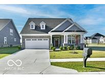 Charming single-Gathering home featuring a gray roof, and a pristine two-car garage at 2186 Chick Evans Way, Westfield, IN 46074