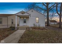 Charming single-story home with a covered porch and a well-maintained front yard at 2421 S Mcclure St, Indianapolis, IN 46241