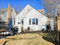 Charming single Gathering home with white siding, well-maintained landscaping, and an inviting front entrance at 2940 Mckinley St, Anderson, IN 46016