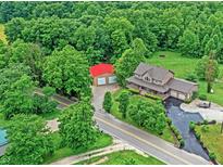 Sprawling country home on an expansive lot with mature trees and a detached garage at 4590 Turkey Track Rd, Martinsville, IN 46151