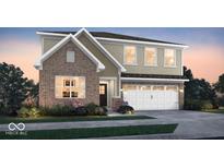 Beautiful two-story home with a brick facade and a two-car garage at 7523 Fallsworth Dr, Avon, IN 46123