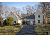 Charming yellow home with well-manicured lawn and inviting driveway at 12348 Seaway Cir, Indianapolis, IN 46236