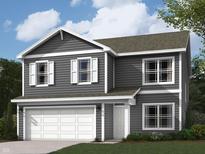 Charming two-story home showcases a well-maintained lawn, two-car garage, and a welcoming front porch at 3271 W Keepsake Ln, Monrovia, IN 46157