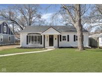 Charming home featuring a manicured front yard and tasteful architectural details at 5326 Graceland Ave, Indianapolis, IN 46208