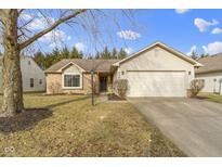 Charming one-story home with a well-maintained lawn and attached two-car garage at 436 E Pine Ridge Dr, Westfield, IN 46074