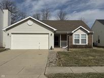 Charming single-story home featuring a two-car garage, brick accents, and a well-maintained lawn at 1804 Austin Dr, Lebanon, IN 46052