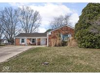 Charming brick ranch-style home with a covered porch and inviting curb appeal at 1840 Hibiscus Dr, Indianapolis, IN 46219