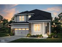Charming two-story home with gray siding, stone accents, two-car garage, and professional landscaping at 2758 Penn Ave, Plainfield, IN 46168