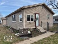 Charming single-story home with neutral siding and a well-maintained front yard at 3002 16Th St, Columbus, IN 47201