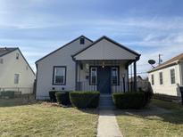 Charming single-story home with a covered porch, tidy landscaping, and a welcoming walkway to the front door at 4349 Fletcher Ave, Indianapolis, IN 46203