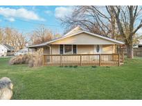 Charming one-story home featuring a welcoming front porch and well-maintained lawn at 5414 Old Smith Valley Rd, Greenwood, IN 46143