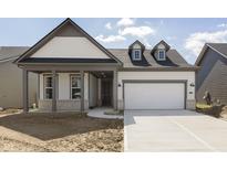 Charming single-Gathering home with a two-car garage and welcoming front porch at 5647 Stetson Dr, Whitestown, IN 46052