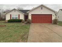 Charming single Gathering home featuring a red garage door and shutters plus a well-manicured front yard at 6484 Townsend Way, Indianapolis, IN 46268
