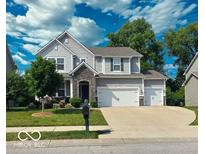 Charming two-story home with stone accents, well-maintained lawn, and a spacious two car attached garage at 655 Bracknell Dr, Avon, IN 46123