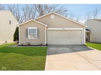 Charming single-story home featuring a one car garage, lawn, and neutral siding at 9049 Southernwood Way, Indianapolis, IN 46231