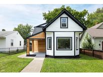 Charming two-story home featuring a modern exterior design and a well-manicured lawn at 1026 Jefferson Ave, Indianapolis, IN 46201